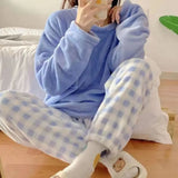 Women's blue fleece pyjamas set with solid top and plaid pants - warm winter sleepwear from IkoChic.